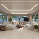 Modern living room with white furniture, large windows, and a view of water.